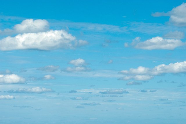 a long distance view of a sky with clouds to the horizon