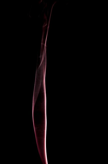 abstract twisting line of smoke on a black background