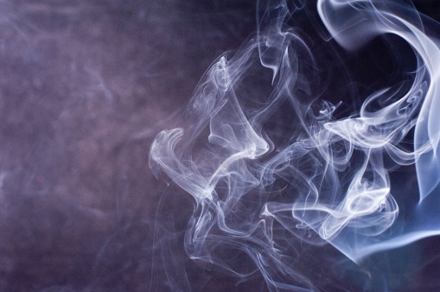 a misty smoky effect background with blue wisps of vapour