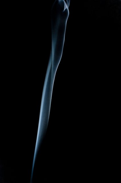 a background composed of a twisting ribbon of smoke