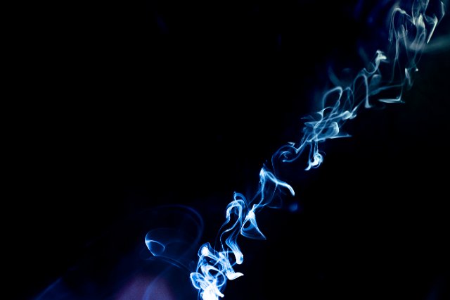 a diagonal line of colourful wisps of smoke