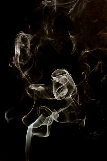 abstract wisps of smoke on a black backdrop