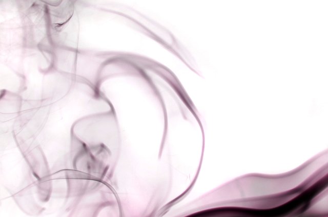 wisps of colored smoke on a white background