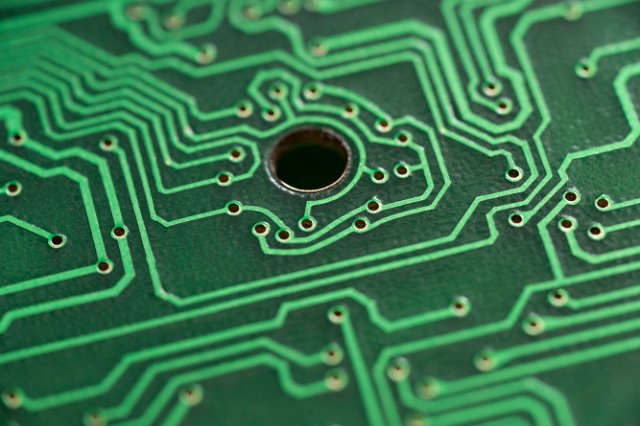 close up on a green printed circuit board
