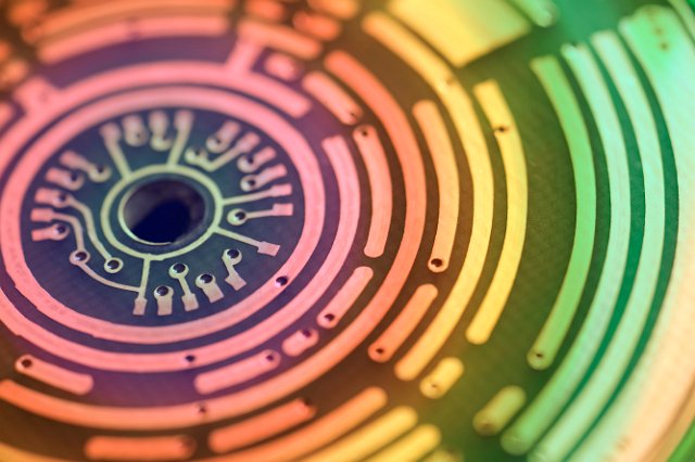 coloured concentric curved lines, macro image of an electronic PCB