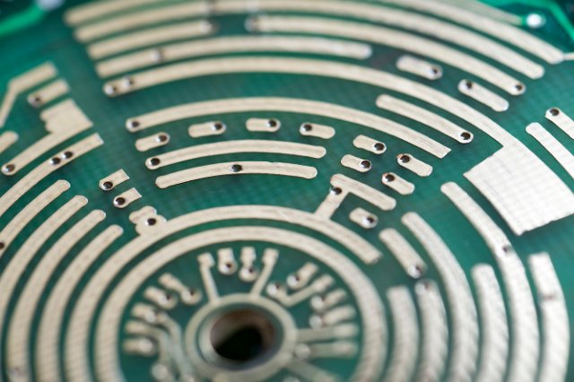 curved concentric tracks traced on an electronic circuit card