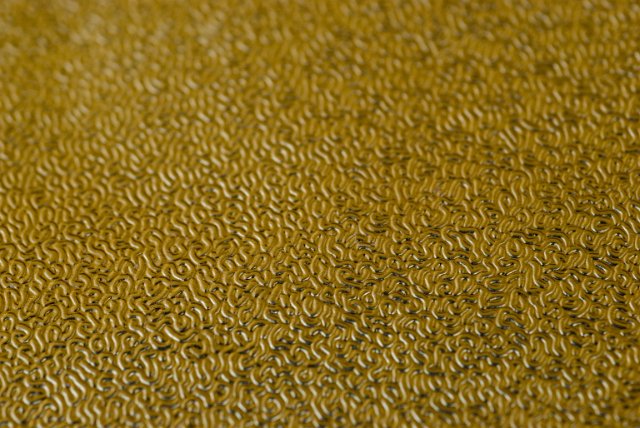 rippled texture of gold coloured textured foil