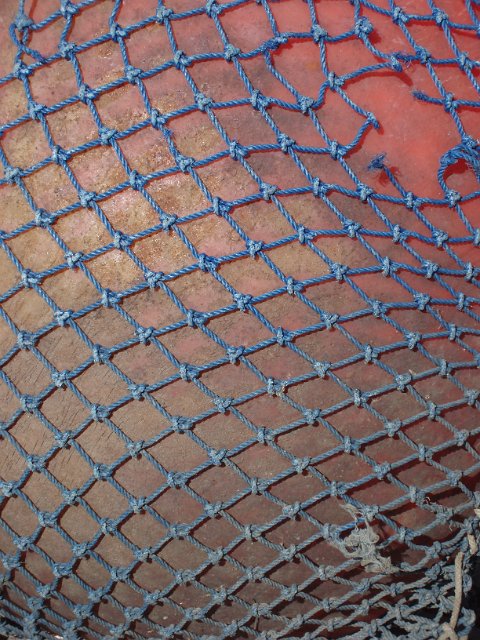 a marine float and net on a quayside