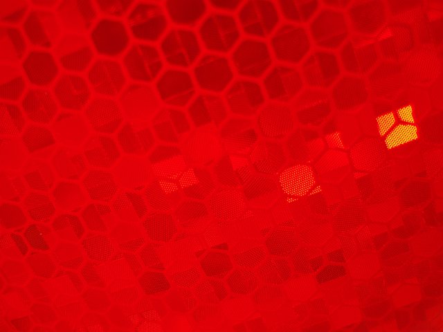 close up on a red roadside reflector
