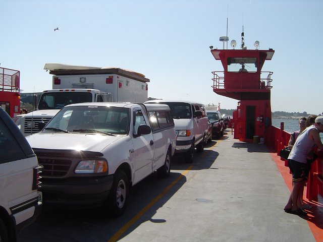 cars lined up on a car ferry barge