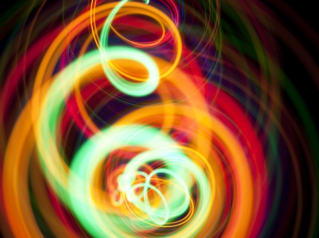 a colorful spiral of twisting light and color