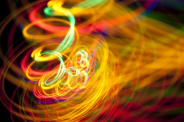 a random spaghetti of colorful light in turmoil