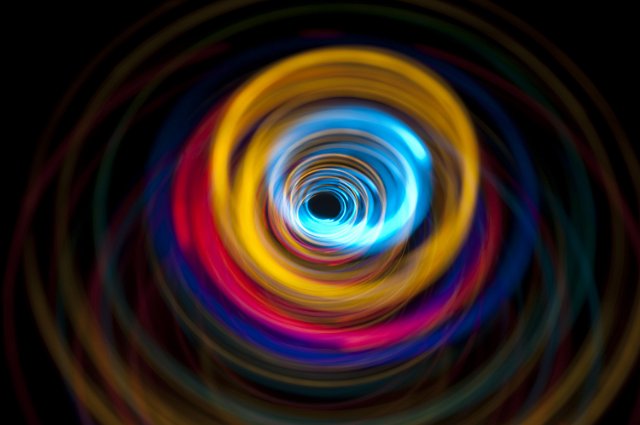colored lines creating a whirlwind vortex of light