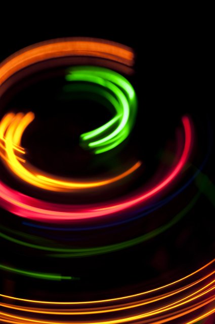 colorful arcs of diffuse glowing light plotting a circular path