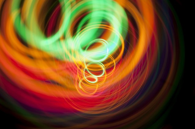 a spiral of coloured light lines disappearing into the distance