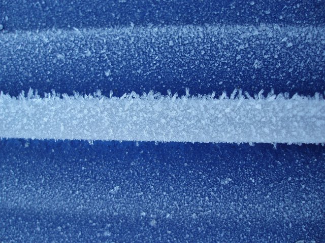 ice crystals on car chromework - a winters morning in the uk
