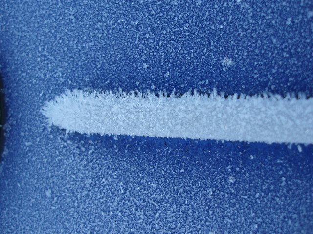 mcaro image of hoar frost crystals on a blue car body