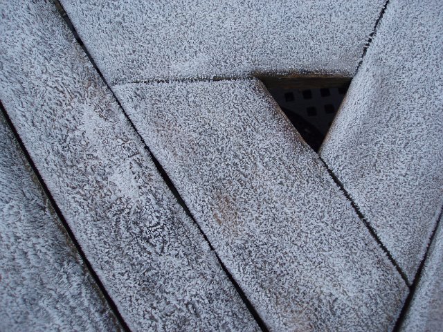 frost on a wooden triangle shape