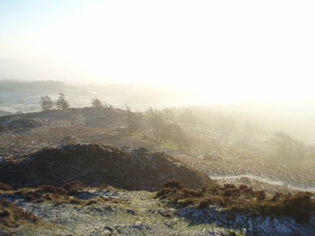 cumbria mountain top winter landscape with lens flare