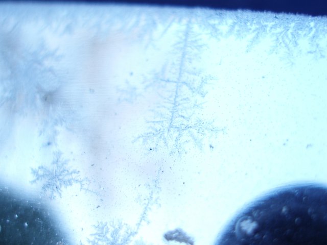 frost covering a car windscreen, high key