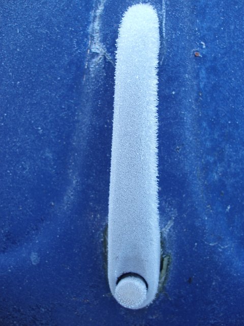 frost on a bonnet handle of a classic volkswagen