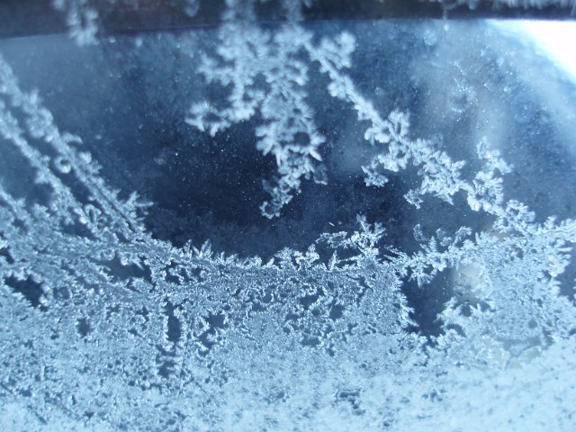 macro image of frost crystals on a car windscreen