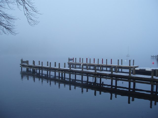 foggy winter day over a serene lake