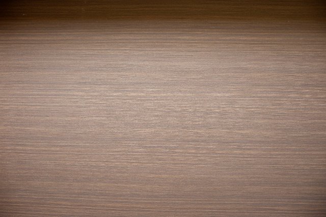 Background texture of faux wood made of plastic laminate for modern interior decorating