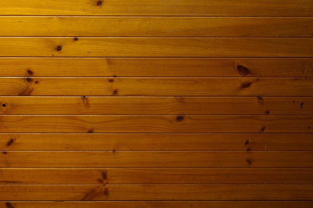 golden orange stained pine softwood cladding on a house interior