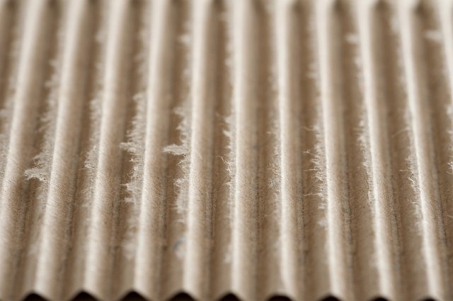 Recycled corrugated brown paper for packaging in a full frame oblique angle view
