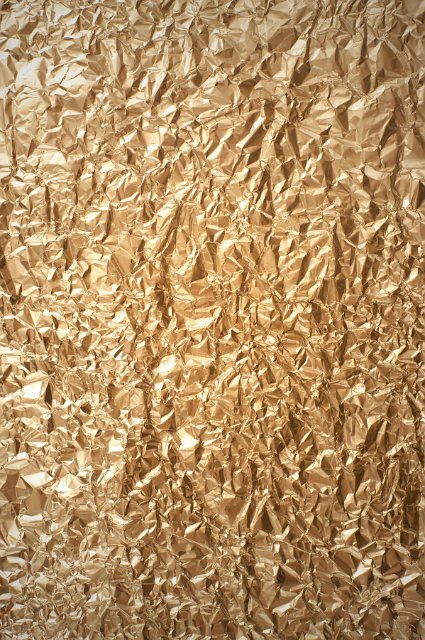 Full Frame of Crumpled Gold Foil, Abstract Background of Shiny Metallic Wrinkled Golden Paper
