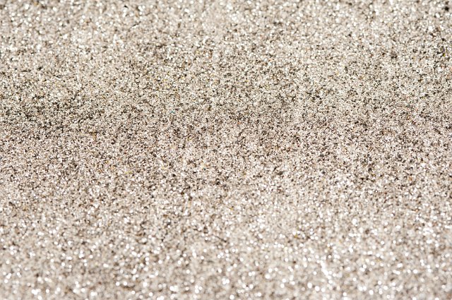 Full frame silver glitter festive background texture for a Christmas themed concept