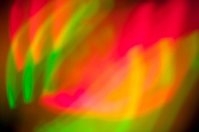 brightly coloured red and green lights mixing to form yellow