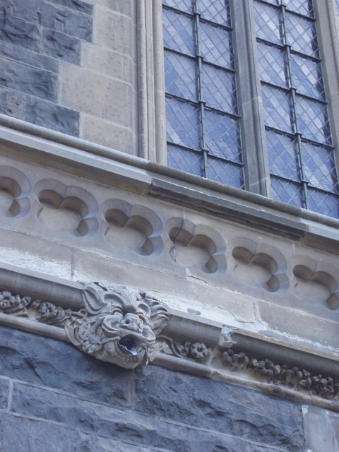 church details, a gargoyle with led pipe mouth