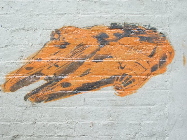 stencil graffiti spray in the design of the millennium falcon