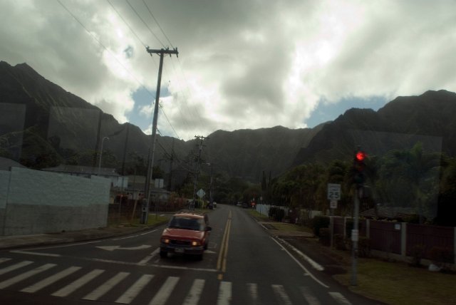 abstract image of a car on a stormy day with an hawaiian mountain background