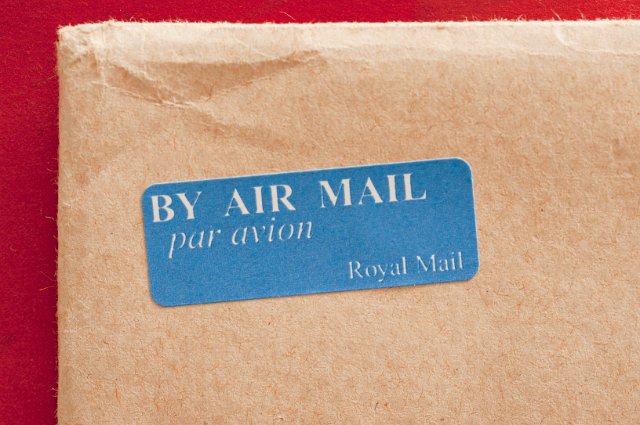 brown envelope with an air mail sticker on it
