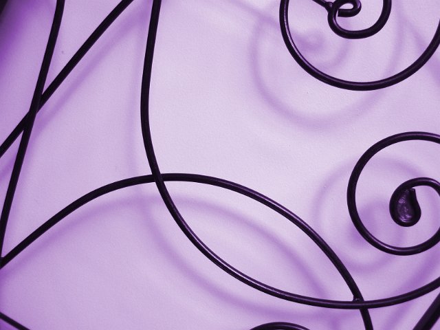 purple background with orante metal crisscrossing lines