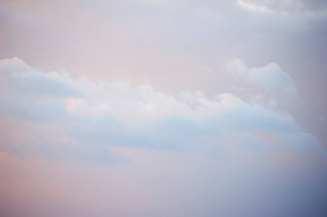 pink storm light illuminating a Nimbostratus cloud layer