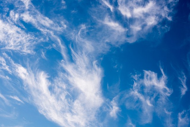 a sky filled with swirling wispy cirrus clouds
