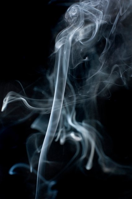 abstract vapours of smoke patterns on a black backdrop