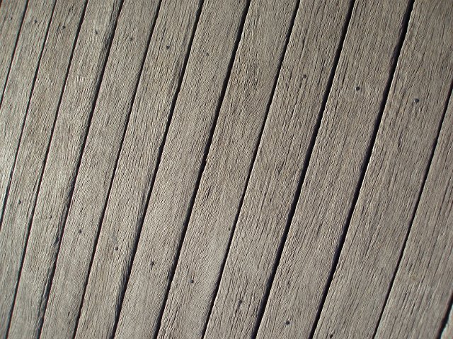 wooden decking with jet washed and sun bleached surface