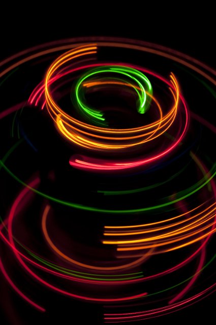 a colourful series of circular arcs plotted against a black background